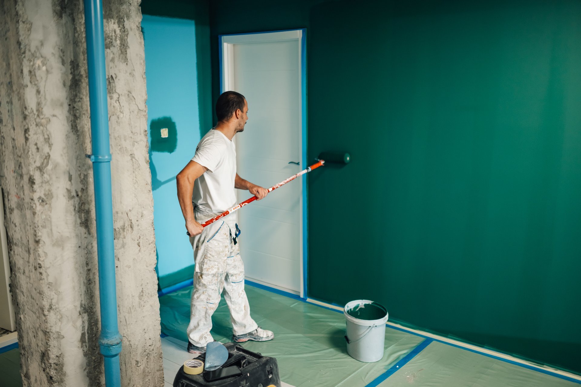 Professional painter applying paint